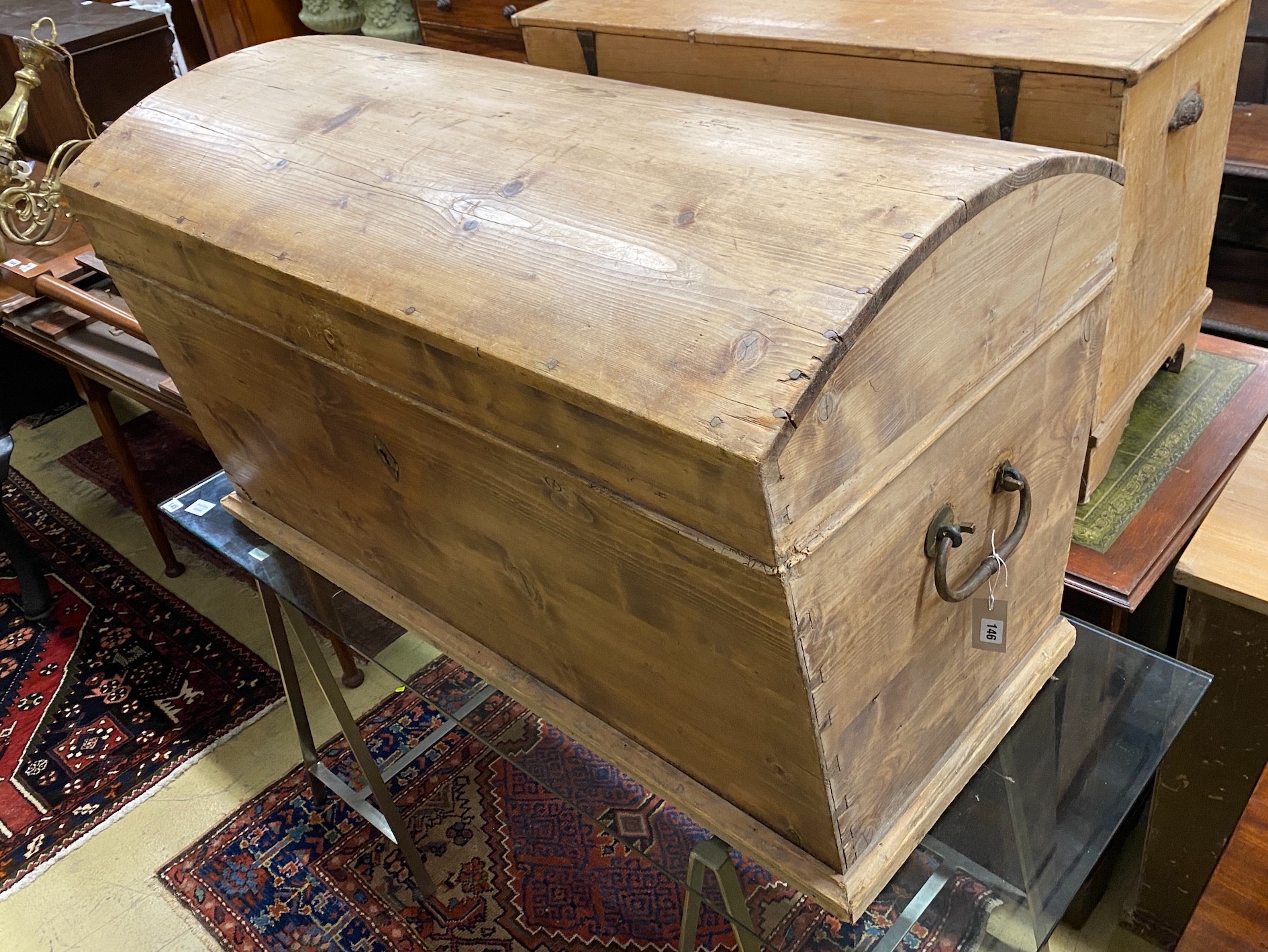 A 19th century continental pine domed top trunk, length 118cm, depth 63cm, height 70cm